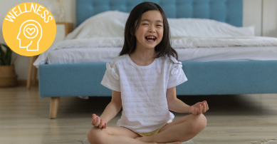 child laughing yoga pose