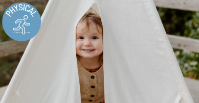 child peeping out of den