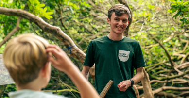 Survival camp instructor teaching child