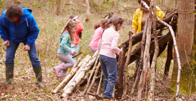 Children building a den outside