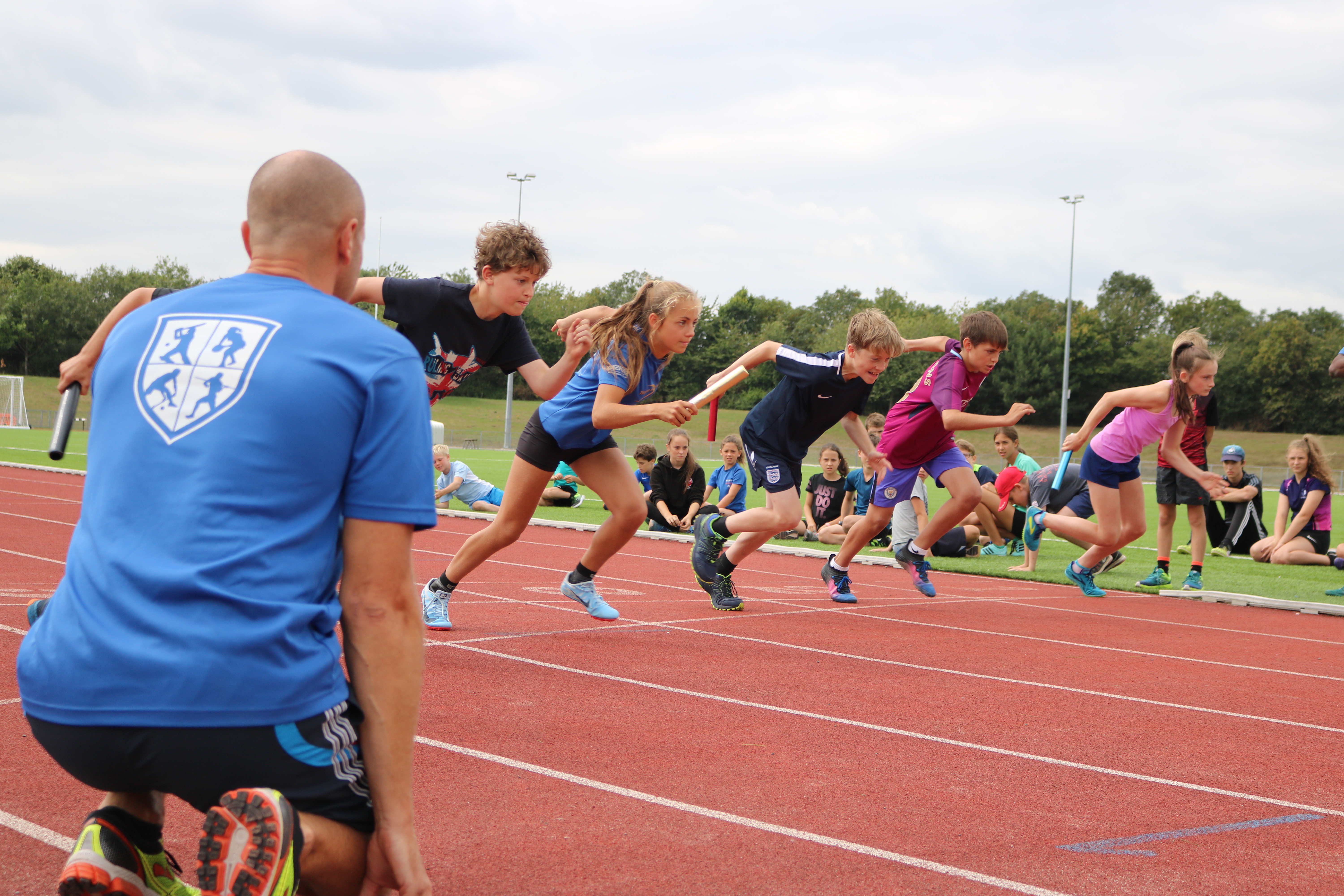 Kids running relay race