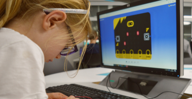 Girl coding on a computer
