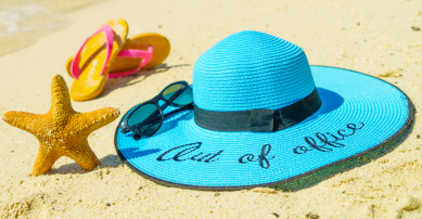 Out of office hat on sand