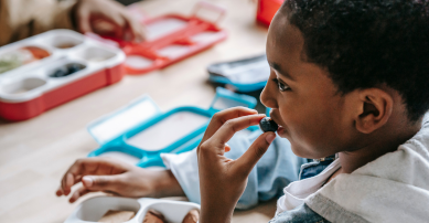 child eating lunch