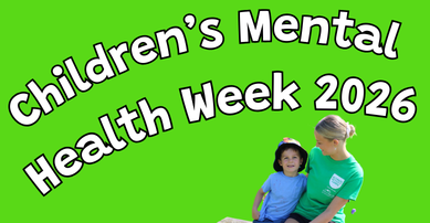 Boy cuddling staff member