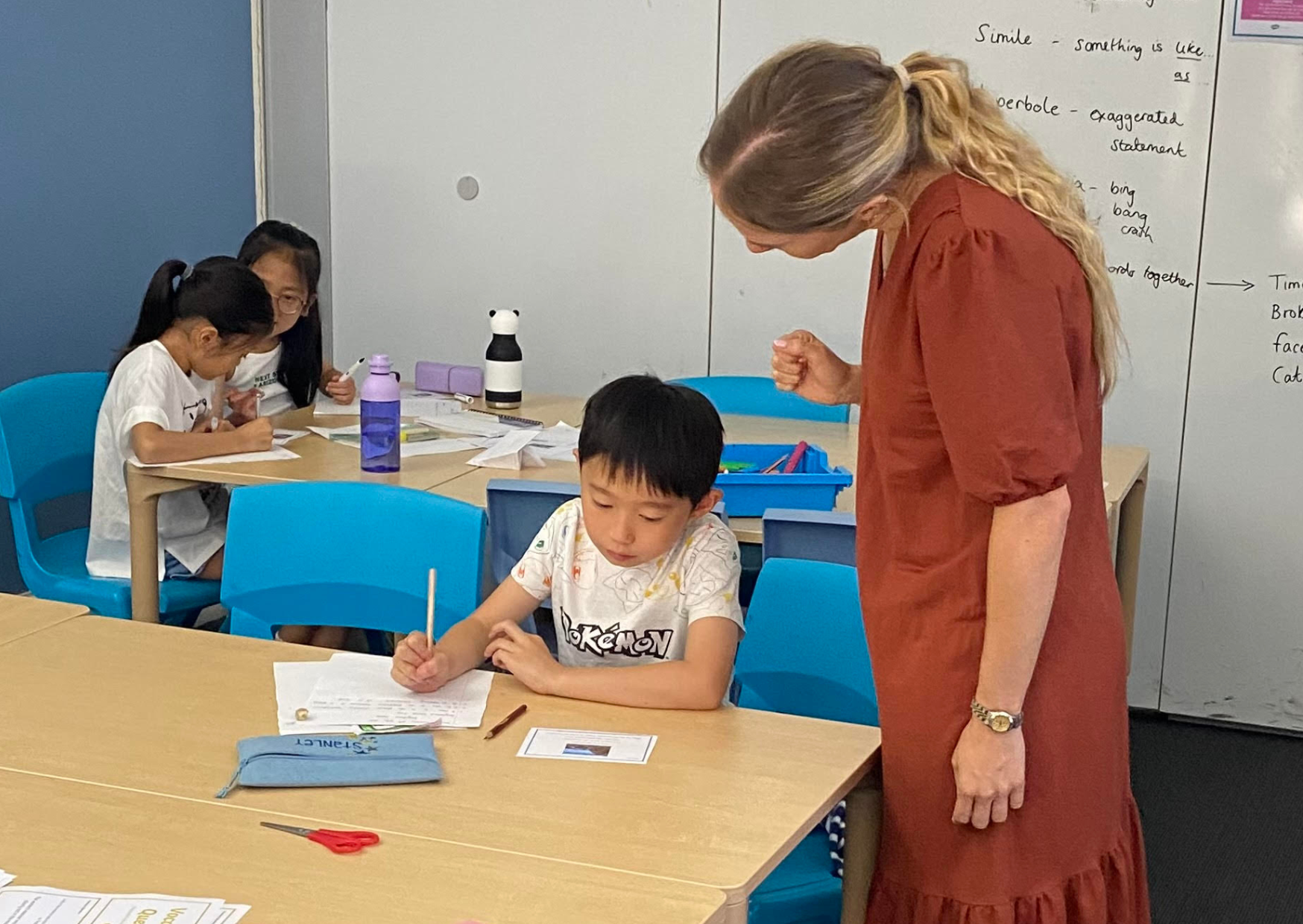 student and tutor practicing for the 11+ exam