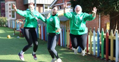 3 staff members jumping