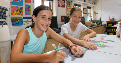 two girls doing art