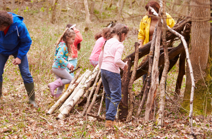 Children building a den outdoors