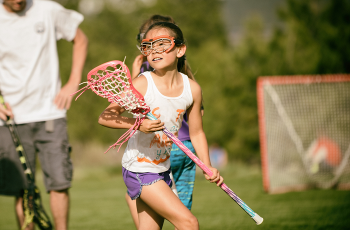 Girl playing lacrosse