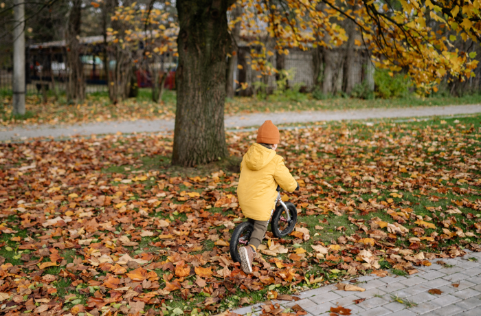 Boy on a bike in Autumn in the UK