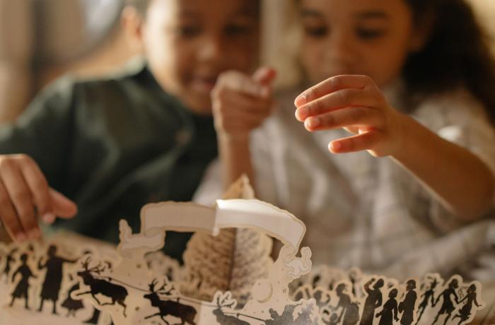 Children reading pop up book
