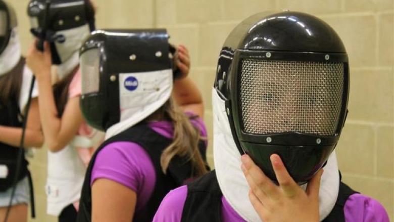 Girl in fencing mask