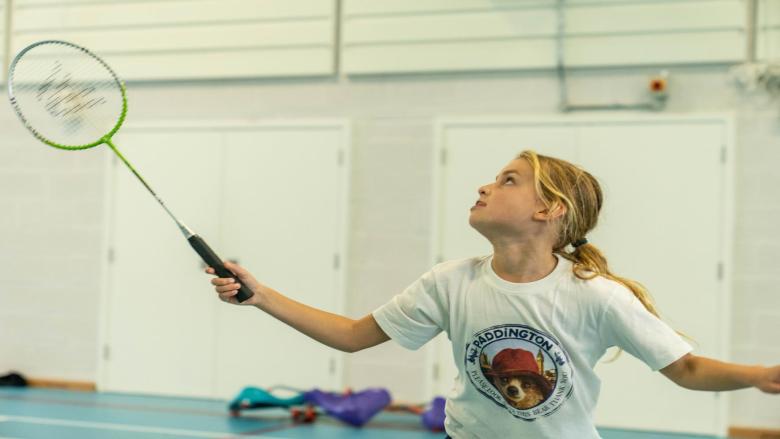 girl playing badminton