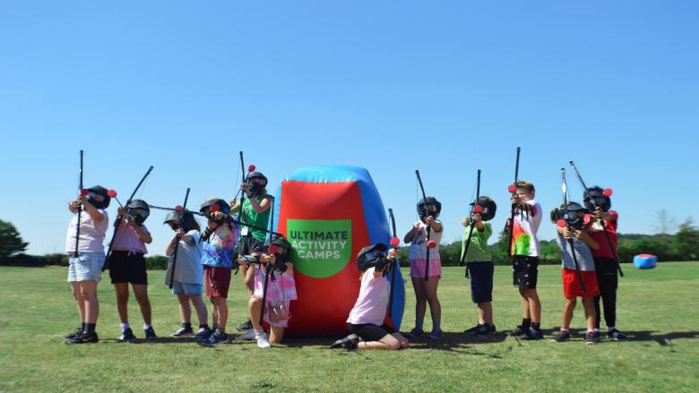 Large group of children doing combat archery