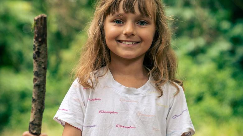 Girl with stick