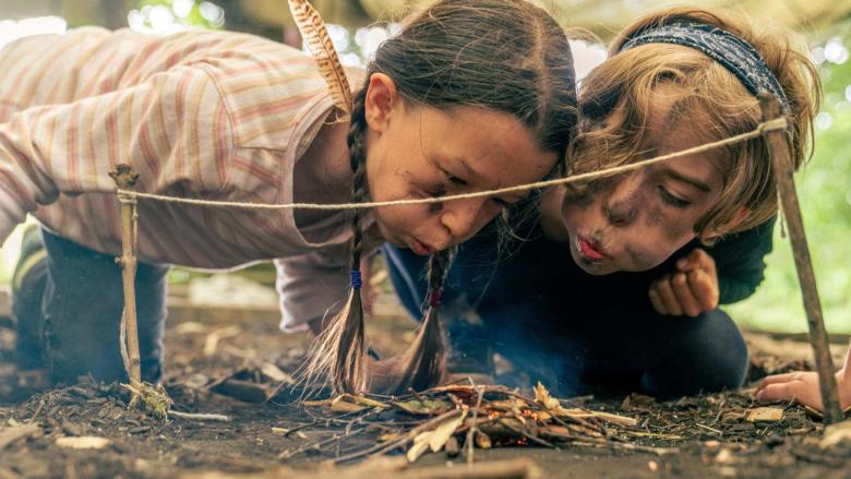 Girls blowing a fire