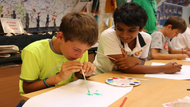 Two boys doing art