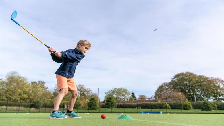 Boy playing golf