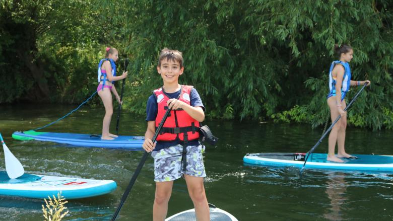 Boy paddleboarding