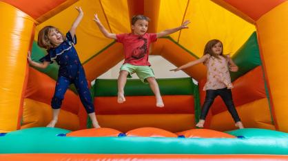 Young children on bouncy castle