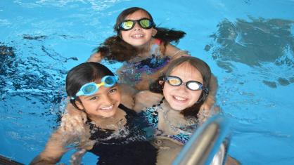 Three girls swimming