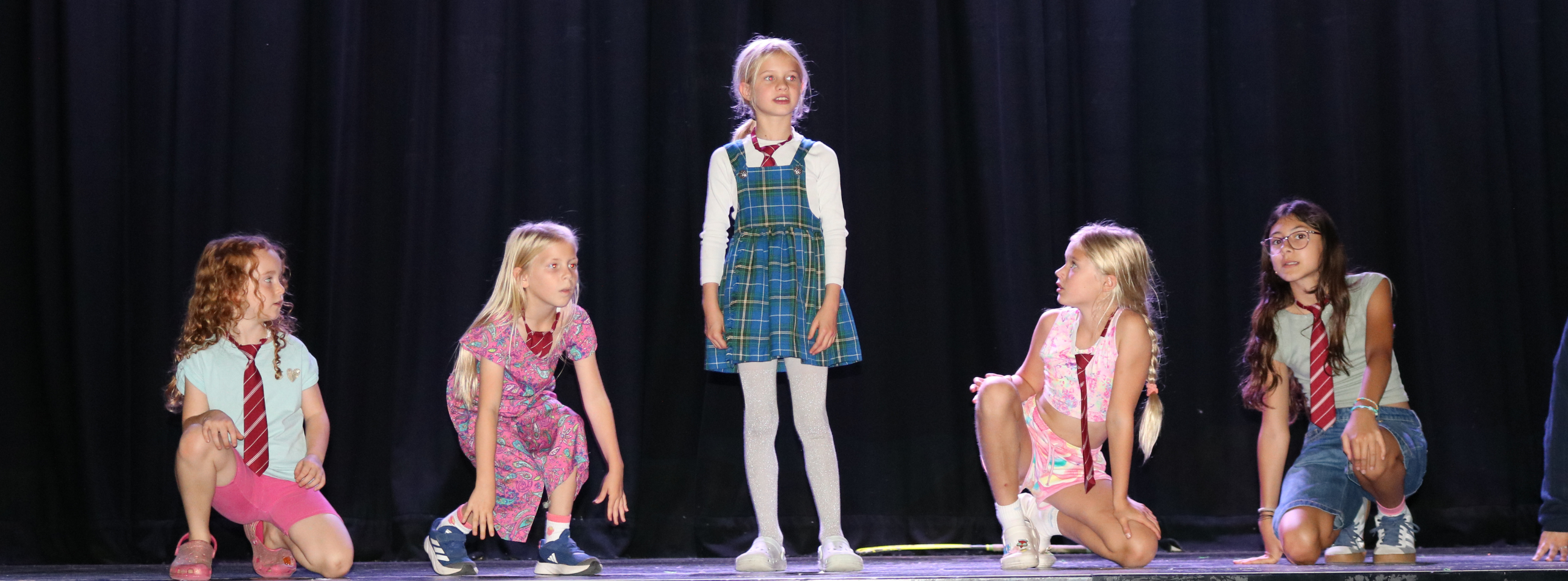 Children on stage performing