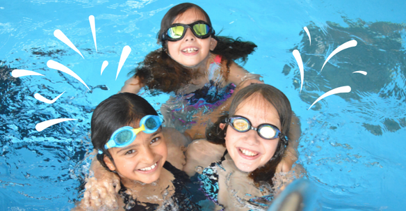 Three children swimming together